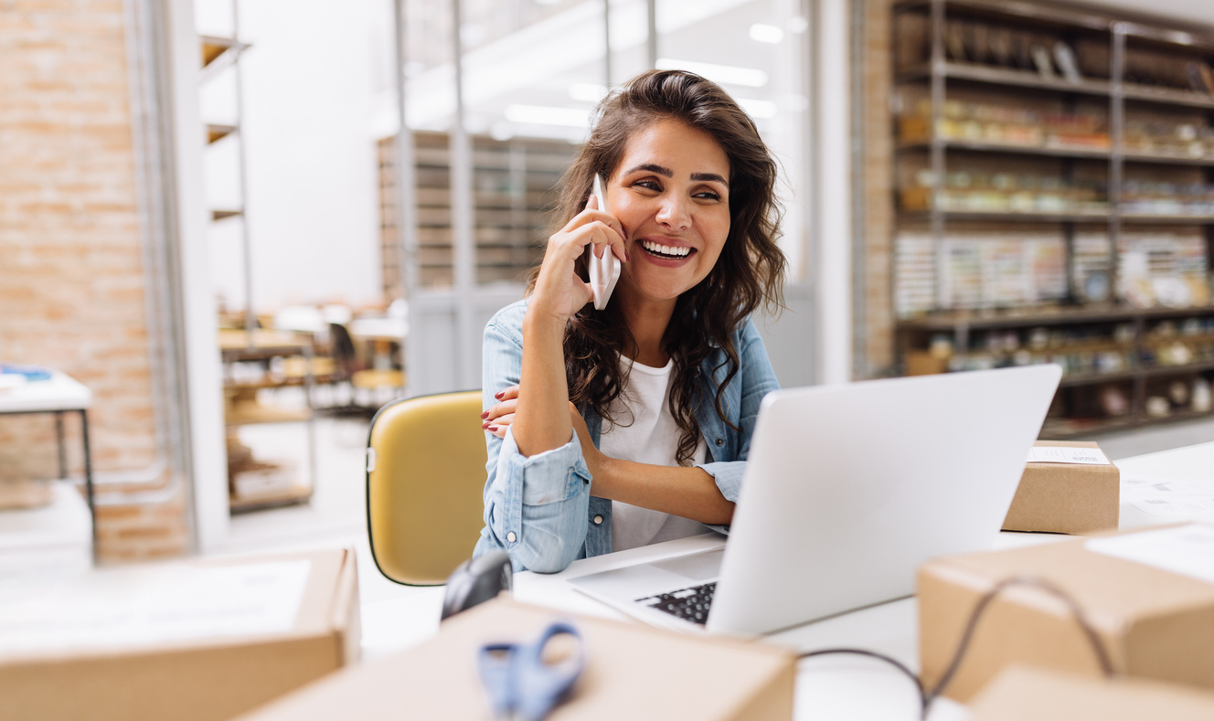 https://cdn.docjacket.com/blog-images/woman-on-phone-and-laptop-smile.jpg